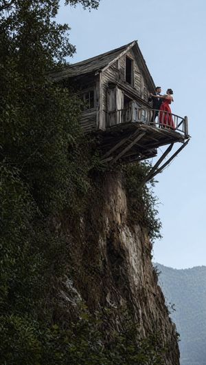 Dancing Couple on Cliffside House