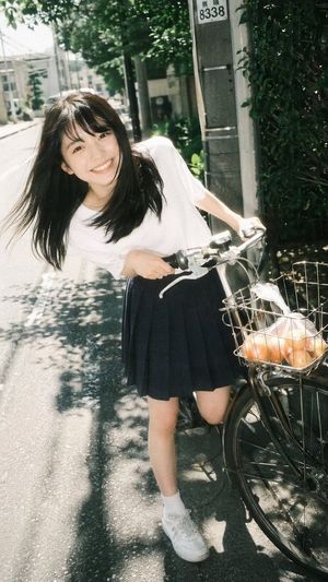Vintage Film Portrait of Girl with Bicycle
